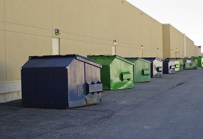 large construction waste containers in a row at a job site in Kendallville, IN